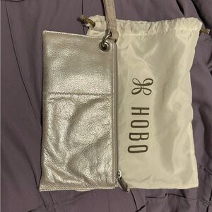 HOBO Vida Metallic Silver Wristlet with silver hardware.